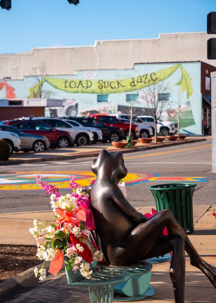 The frog statue in downtown Conway from behind.